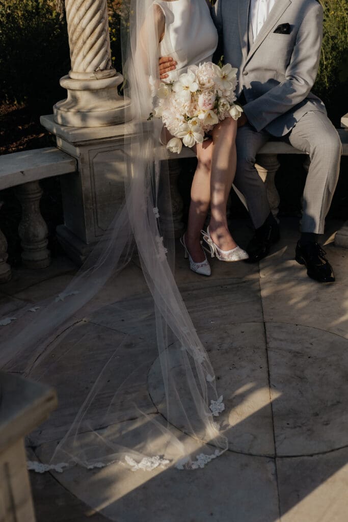 Bride and groom sitting together.